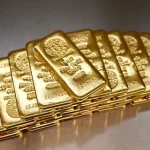 Queda do Ouro Atinge 12% em Outubro com Expectativas de Cautela do Fed